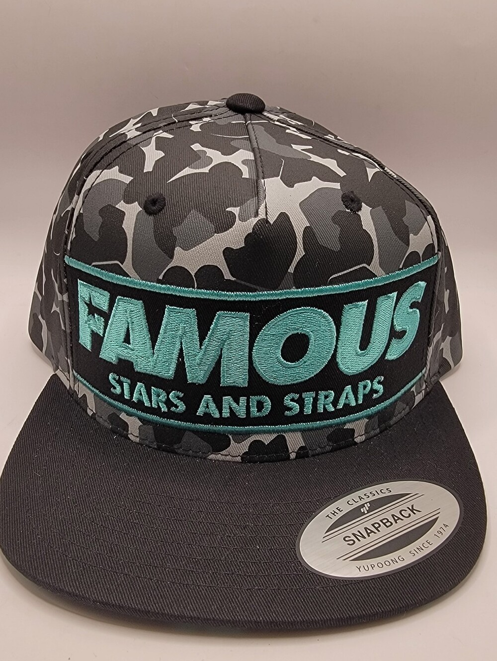 Famous Stars & Straps Black & Gray Camo Snapback with Teal Logo